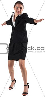 Businesswoman standing with arms out