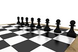 Black chess pawns on board