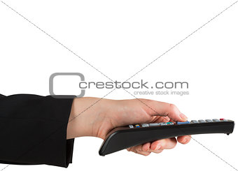 Female hand pressing remote control