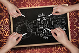 Composite image of multiple hands drawing brainstorm with chalk
