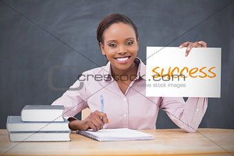 Happy teacher holding page showing success