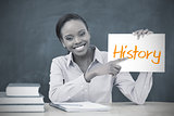 Happy teacher holding page showing history