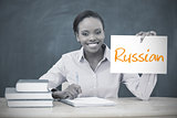 Happy teacher holding page showing russian