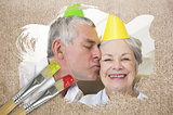 Composite image of senior couple celebrating birthday