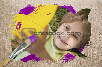 Composite image of little boy smiling at camera