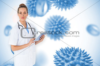 Composite image of pretty nurse using tablet pc