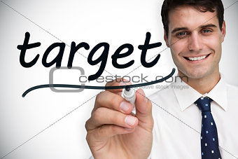 Businessman writing the word target