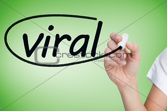 Businesswoman writing the word viral