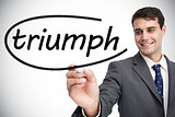 Businessman writing the word triumph