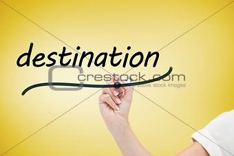 Businesswoman writing the word destination