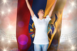 Composite image of pretty football fan in white cheering holding ecuador flag