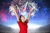 Composite image of cheering football fan in red