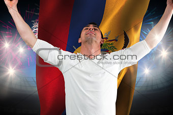 Composite image of excited football fan cheering