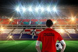 Composite image of croatia football player holding ball