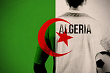 Composite image of algeria football player holding ball