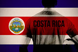 Composite image of costa rica football player holding ball