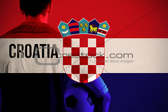 Composite image of croatia football player holding ball