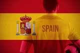 Composite image of spain football player holding ball