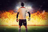 Composite image of goalkeeper standing in white jersey