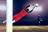 Composite image of goalkeeper in red jumping up