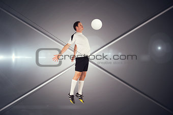Composite image of football player in white jumping