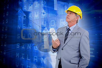 Composite image of mature architect taking a close look