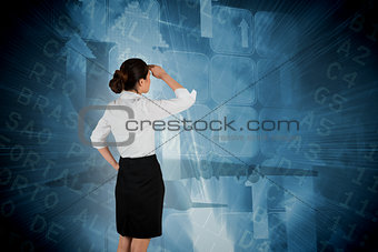 Composite image of young businesswoman standing and looking