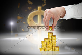 Composite image of businessman holding coins