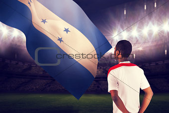 Composite image of football fan in white standing
