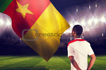 Composite image of football fan in white standing