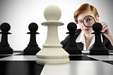 Composite image of focused businesswoman with magnifying glasses