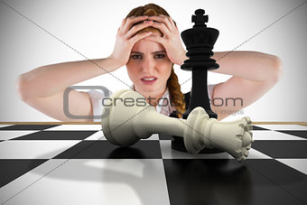Composite image of stressed businesswoman with hands on head