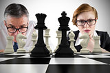 Composite image of business people and chessboard