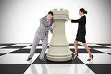Composite image of business people pushing chess piece