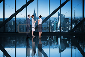 Composite image of business colleagues talking