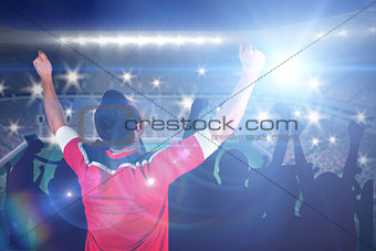 Composite image of excited football fan cheering
