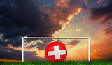 Composite image of football in swiss colours
