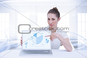 Composite image of businesswoman showing a laptop