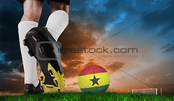 Composite image of football boot kicking ghana ball