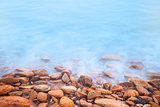 Shore of the sea, stones  and flowing water 