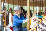 boy at carousel