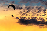 unidentified skydiver, parachutist on blue sky