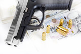 gun with bullet on czech banknotes