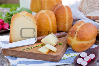 Traditional smoked cheese still life.