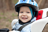 Little boy in bicycle seat