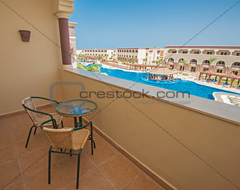 Chairs and table on hotel balcony