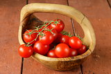 fresh ripe organic tomatoes on a wooden table