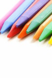 multicolored pencil crayons on a white background
