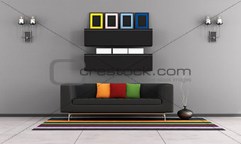 Contemporary living room with black couch
