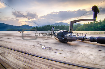 fishing tackle on a wooden float with mountain background in nc